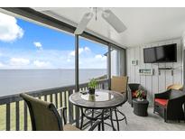 Spacious balcony with water view, seating area, and ceiling fan at 826 Bahia Del Sol Dr # 55, Ruskin, FL 33570