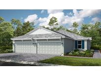 Two-car garage, light gray exterior, and landscaping at 10522 Eclipse St, Sarasota, FL 34241