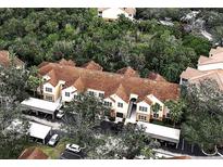 Aerial view of Bella Villino condos, showcasing building exteriors and lush landscaping at 4122 Central Sarasota Pkwy # 1914, Sarasota, FL 34238