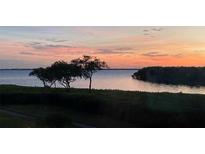 Stunning sunset over the water, creating a picturesque waterfront view at 4600 Gulf Of Mexico Dr # 206, Longboat Key, FL 34228