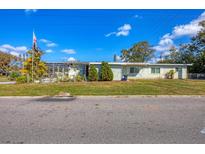 Charming single-story home featuring a well-maintained lawn and a view of the front yard at 217 46Th W St, Bradenton, FL 34209
