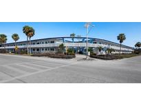 Lido Dorset building exterior, featuring a mid-century modern design and ample parking at 475 Benjamin Franklin Dr # 215, Sarasota, FL 34236