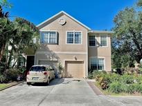 Two-story house with attached garage and landscaping at 3878 Deberry Dr, Sarasota, FL 34233