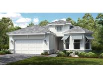 White two-story house with gray roof, landscaping, and two-car garage at 8040 Moonbeam Avenue, Sarasota, FL 34241