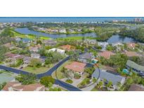 Aerial view of a waterfront home in a luxury community at 3318 Bayou Sound, Longboat Key, FL 34228
