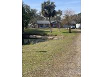 Single-story home with pond and large yard at 5016 37Th E St, Bradenton, FL 34203