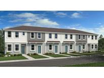 Modern townhome exterior with gray and white siding, and teal doors at 8958 Daybreak St, Sarasota, FL 34241