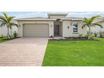 One-story home with a two-car garage and attractive landscaping at 16008 Crofton Springs Way, Port Charlotte, FL 33953