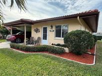 Well-maintained house with carport and nicely landscaped front yard at 6504 Bowdoin Pl # 15, Bradenton, FL 34207