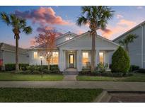 Charming one-story home with a welcoming front porch and landscaped yard at 11712 Golden Bay Pl, Bradenton, FL 34211