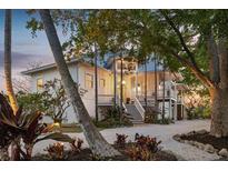 Stunning waterfront home with landscaped grounds at 6821 Longboat S Dr, Longboat Key, FL 34228