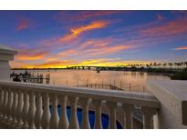 Stunning sunset over the water, seen from a private balcony at 166 Golden Gate Pt # 21, Sarasota, FL 34236