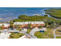 Aerial view of townhomes featuring private driveways and waterfront location at 4009 Catalina Dr # 178, Bradenton, FL 34210