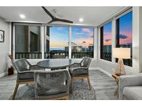 Bright dining area with ocean view and seating for four at 5780 Midnight Pass Rd # 609, Sarasota, FL 34242