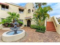 Spanish style building exterior with fountain and lush landscaping at 6101 34Th W St # 28B, Bradenton, FL 34210