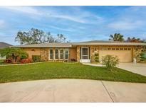 Attractive ranch home with stone accents and a well-manicured lawn at 7510 16Th Nw Ave, Bradenton, FL 34209