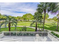 Scenic balcony view overlooking lush landscaping and a tranquil waterway at 250 Sands Point Rd # 5105, Longboat Key, FL 34228