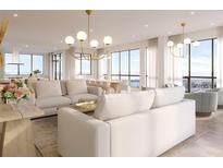 Bright living room with city views, plush sofas, and modern light fixtures at 33 S Palm Ave # 1601, Sarasota, FL 34236