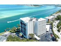 Stunning aerial view of condo building with gorgeous waterfront views of blue ocean at 4822 Ocean Blvd # 8C, Sarasota, FL 34242