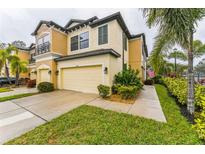 Two-story townhome with attached garage and landscaped front yard at 5272 78Th St E Cir, Bradenton, FL 34203