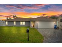 Updated single-story home with a landscaped lawn and a two-car garage at 7803 24Th W Ave, Bradenton, FL 34209