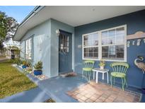 Inviting front porch with seating and coastal decor at 8466 Maureen Ave, North Port, FL 34287