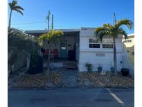 Quaint waterfront home with palm trees and a relaxing patio area at 2601 Gulf N Dr # 729, Bradenton Beach, FL 34217