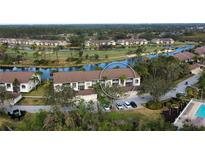 Aerial view of condo community with golf course and lake views at 5250 Hyland Hills Ave # 1515, Sarasota, FL 34241