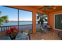 Relaxing screened balcony overlooking waterfront with seating area at 1141 Riverscape St # C, Bradenton, FL 34208