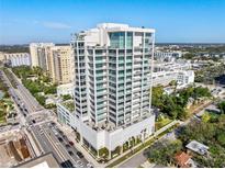 Aerial view of a modern highrise building in a city setting at 540 N Tamiami Trl # 702, Sarasota, FL 34236