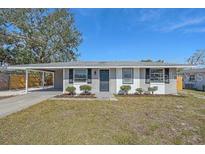 Newly renovated home with carport and landscaped yard at 2807 W 52Nd Ter, Bradenton, FL 34207