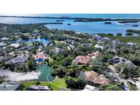 Aerial view of a luxurious home nestled in a waterfront community at 282 Shell Midden Ct, Osprey, FL 34229