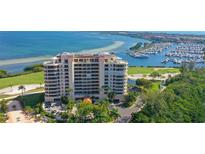 Luxury condo building with water and golf course views at 3010 Grand Bay Blvd # 493, Longboat Key, FL 34228