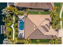 Aerial view of a luxury home with pool and canal access at 579 Fore Dr, Bradenton, FL 34208