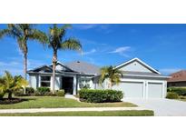 Single-story home with two-car garage and attractive landscaping at 12904 49Th E Ln, Parrish, FL 34219