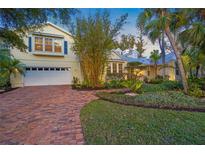 Beautiful two-story home with brick driveway and lush landscaping at 4563 Trails Dr, Sarasota, FL 34232