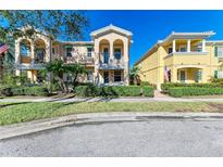 Two-story townhouses with attractive landscaping and inviting curb appeal at 7879 Bergamo Ave, Sarasota, FL 34238