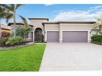 Stunning two-car garage home with lush landscaping at 11101 Sandhill Preserve Dr, Sarasota, FL 34238