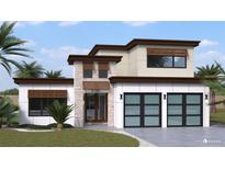 Modern two-story home with two-car garage and landscaped lawn at 2182 Wisteria St, Sarasota, FL 34239