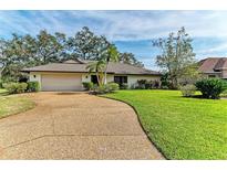 Single-story home with a large front yard, attached garage, and manicured landscaping at 4364 Brandywine Dr, Sarasota, FL 34241