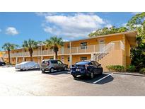 Building exterior featuring parking and landscaping at 936 La Costa Cir # 4, Sarasota, FL 34237