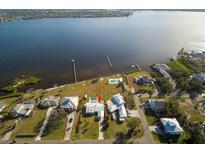 Aerial view of waterfront home with private pool and dock at 4511 7Th Street E Ct, Ellenton, FL 34222