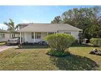 Charming single-story home with a well-manicured lawn and driveway at 2519 17Th W Ave, Bradenton, FL 34205