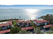 Aerial view of waterfront condos with red tile roofs and lush landscaping at 3460 Wild Oak Bay Blvd # 145, Bradenton, FL 34210