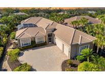 Luxury home with tile roof, large driveway & pool at 45 Grand Palms Blvd, Englewood, FL 34223