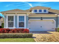 Beautiful two-story home with a two-car garage and well-manicured landscaping at 5099 Flag St, Sarasota, FL 34232