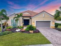 Beautiful one-story home with landscaped yard and two-car garage at 5116 Tivoli Run, Bradenton, FL 34211