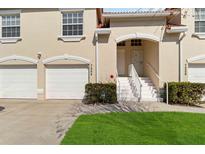 Charming townhome with a two-car garage, a well-kept lawn, and a welcoming entrance at 7254 Cedar Hollow Cir, Bradenton, FL 34203