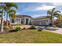 Beautiful home with a three-car garage and lush landscaping at 4745 Benito Ct, Lakewood Ranch, FL 34211