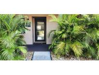 Inviting condo entrance with lush tropical landscaping at 2808 60Th W Ave # 403, Bradenton, FL 34207